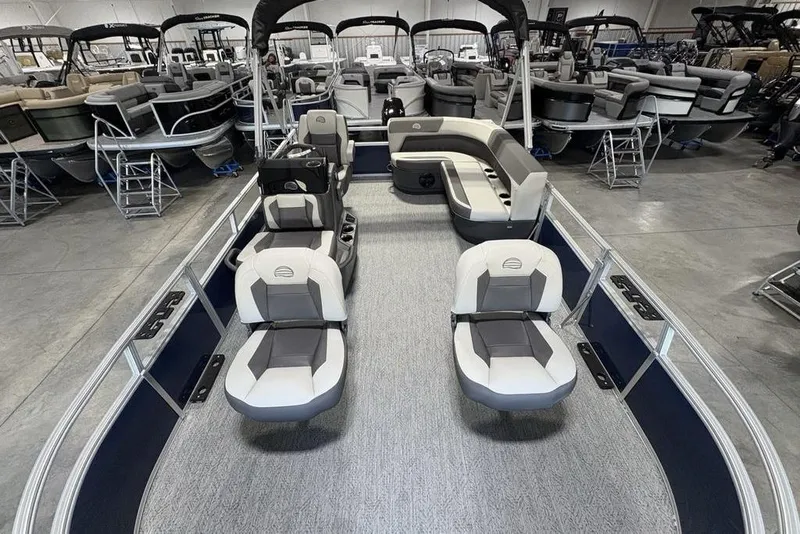 Slide: The Image of 2026 Sun Tracker Bass Buggy 16 XL Select pontoon boat interior with seating and helm. - 22