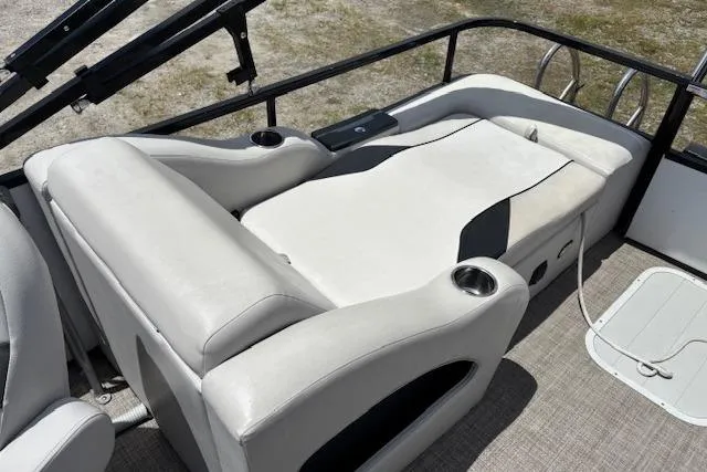Slide: The Image of 2022 Sun Catcher 322 SS boat interior with comfortable seating and cup holders. - 10