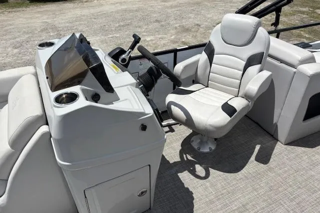 Slide: The Image of Captain's chair and helm of 2022 Sun Catcher 322 SS boat, featuring modern controls. - 12