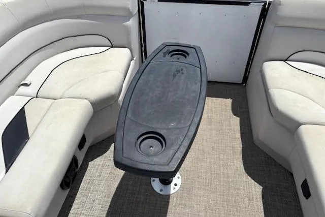 Slide: The Image of Interior of 2022 Sun Catcher 322 SS boat with seating and table. - 16