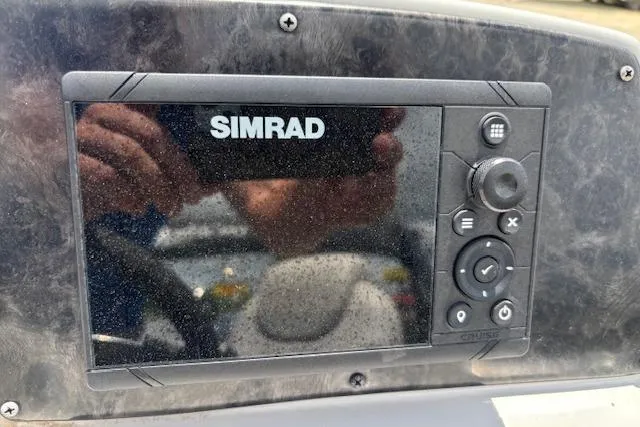 Slide: The Image of Simrad display on 2022 Sun Catcher 322 SS boat dashboard, showing control buttons. - 17