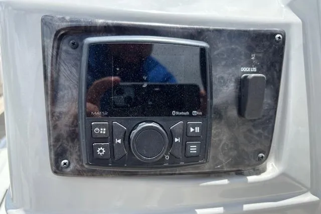 Slide: The Image of Control panel of 2022 Sun Catcher 322 SS boat with Bluetooth and audio settings. - 18
