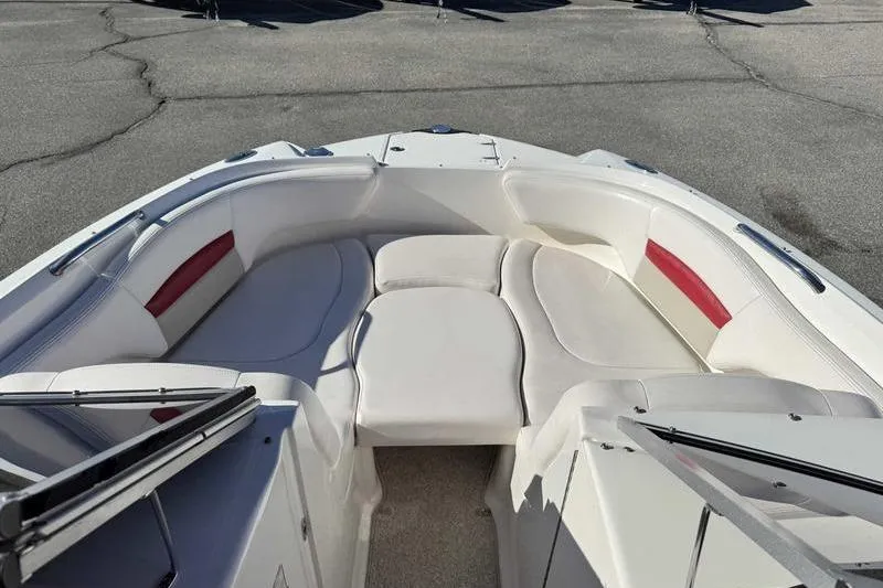 Slide: The Image of 2008 Chaparral 224 Extreme boat interior with white seating and red accents. - 17