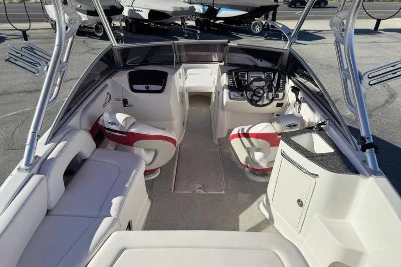 Slide: The Image of Interior of a 2008 Chaparral 224 Extreme boat with seating and steering wheel. - 5