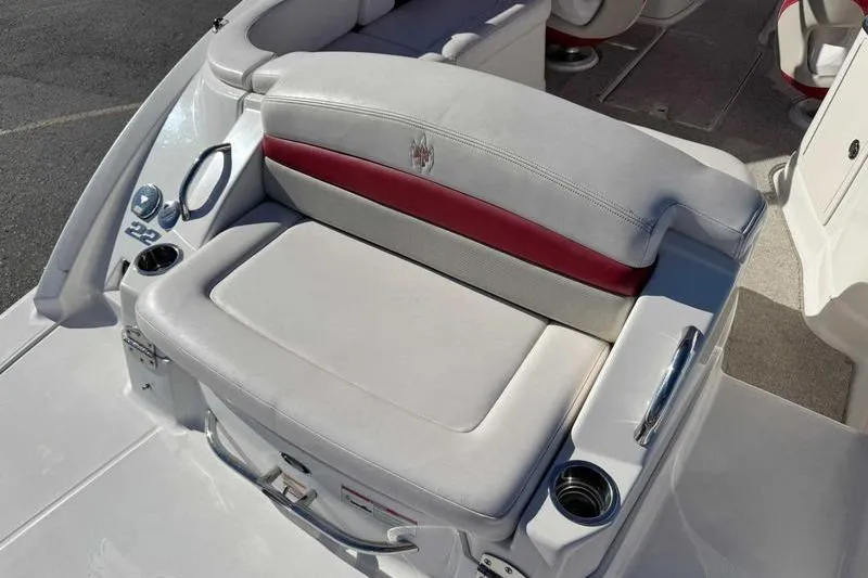 Slide: The Image of 2008 Chaparral 224 Extreme boat seat with cup holders and red accent. - 6