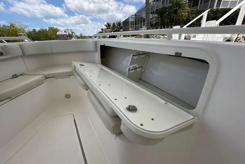 Slide: The Image of 2015 Everglades 295 Center Console boat interior with open storage compartment. - 23