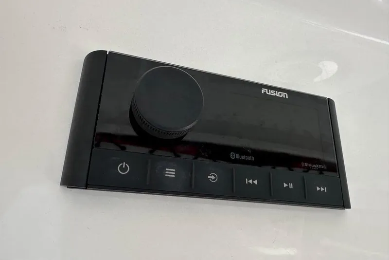 Slide: The Image of Fusion audio control panel on 2015 Everglades 295 Center Console boat. - 29