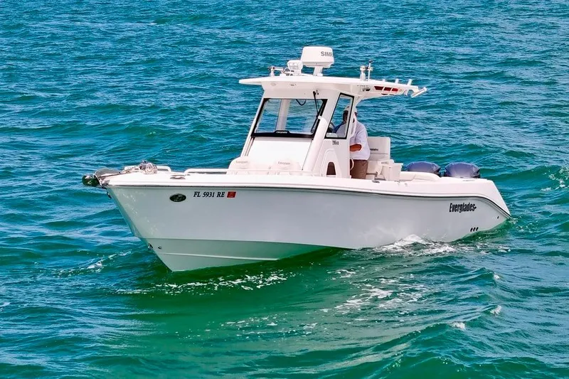 Slide: The Image of 2015 Everglades 295 Center Console boat cruising on open water. - 3