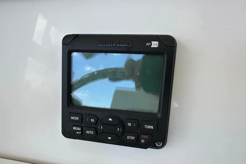 Slide: The Image of Simrad AP24 autopilot control on 2015 Everglades 295 Center Console boat. - 30