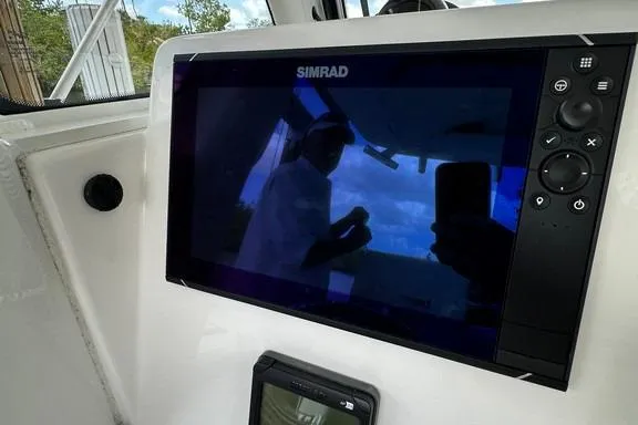 Slide: The Image of Simrad display on 2015 Everglades 295 Center Console boat dashboard. - 36