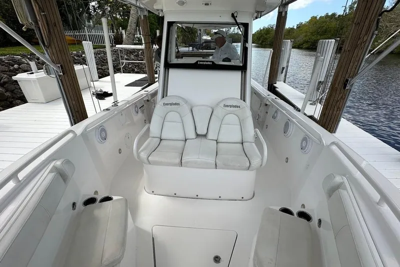 Slide: The Image of 2015 Everglades 295 Center Console boat interior with white seating and console. - 38