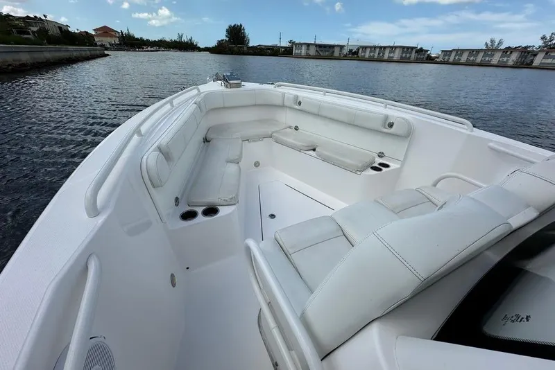 Slide: The Image of 2015 Everglades 295 Center Console boat with spacious seating on calm water. - 49