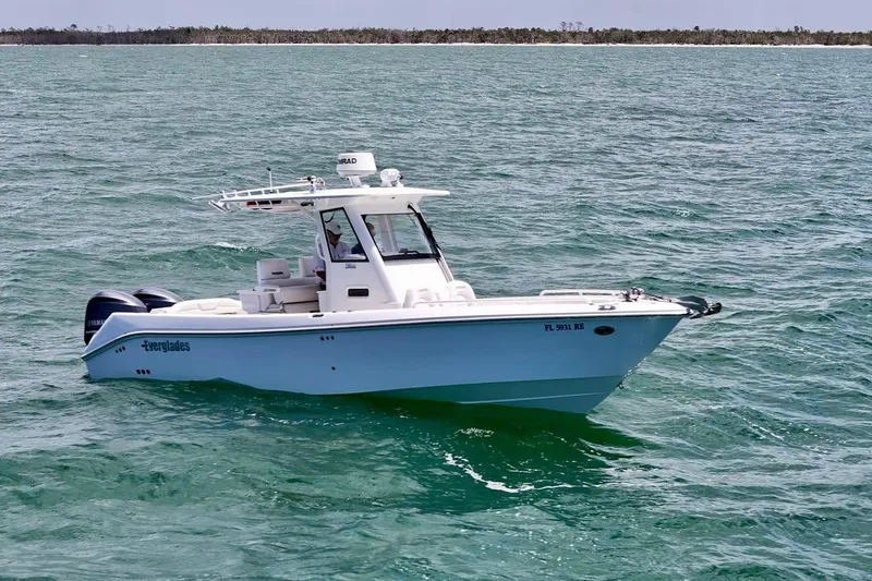 Slide: The Image of 2015 Everglades 295 Center Console boat cruising on open water. - 5