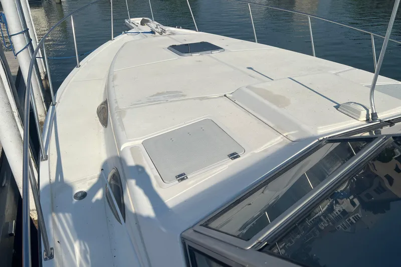 Slide: The Image of 1989 Luhrs 35 Alura boat deck, docked, with clear water view. - 21