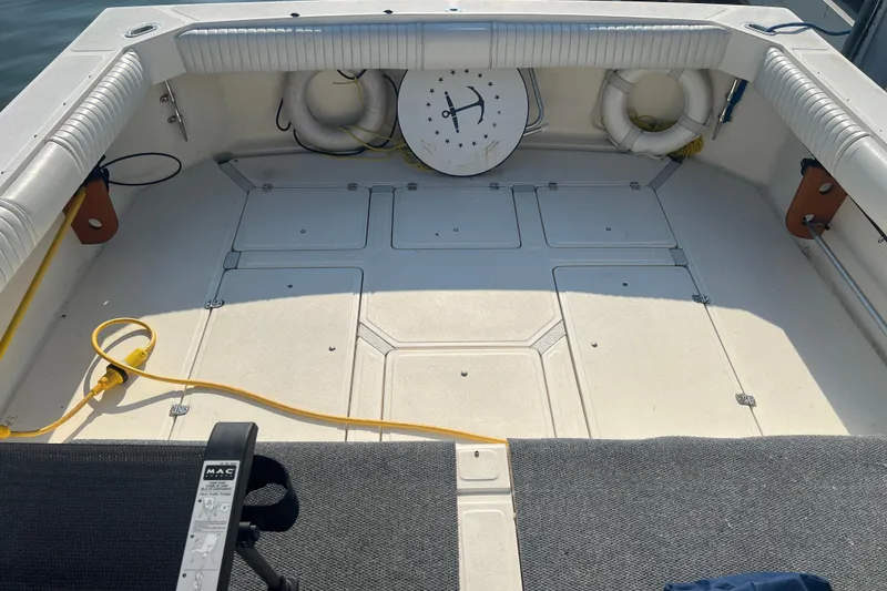 Slide: The Image of 1989 Luhrs 35 Alura boat deck with life rings and cables. - 5