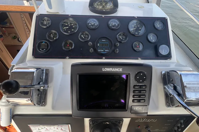 Slide: The Image of Control panel of 1989 Luhrs 35 Alura boat with gauges and Lowrance navigation system. - 7