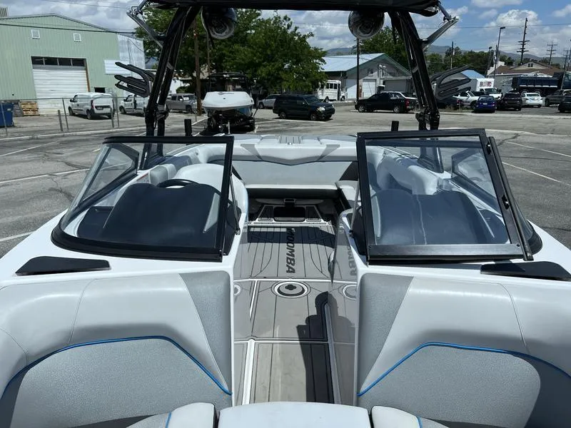 Slide: The Image of 2018 Moomba Mojo™ boat interior with open windshield, gray seating, and visible dashboard. - 3
