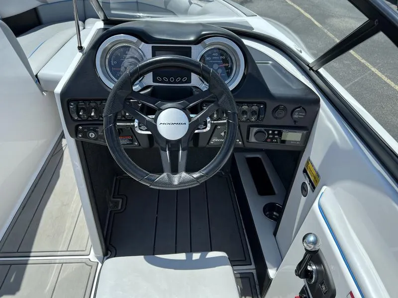 Slide: The Image of 2018 Moomba Mojo™ boat dashboard with steering wheel and control panel. - 5