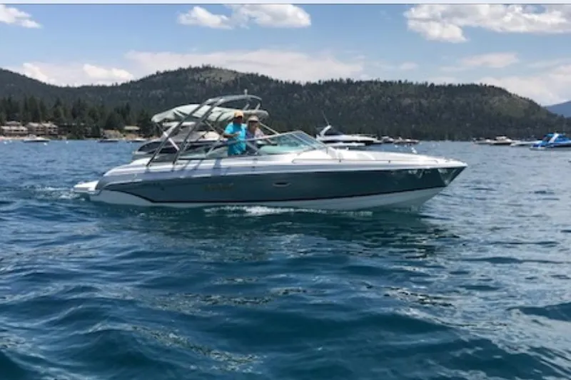 Slide: The Image of 2007 Formula 260 Bowrider cruising on a scenic lake with mountains in the background. - 4