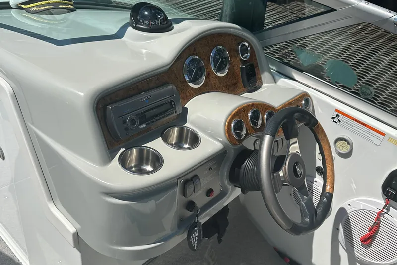 Slide: The Image of 2007 Formula 260 Bowrider dashboard with steering wheel, gauges, and stereo system. - 6