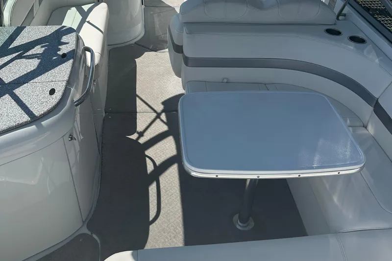Slide: The Image of 2007 Formula 260 Bowrider interior with seating and table, featuring sleek design and cup holders. - 7