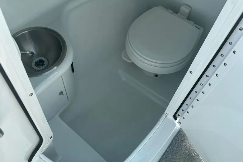 Slide: The Image of 2007 Formula 260 Bowrider boat bathroom with sink and toilet. - 8