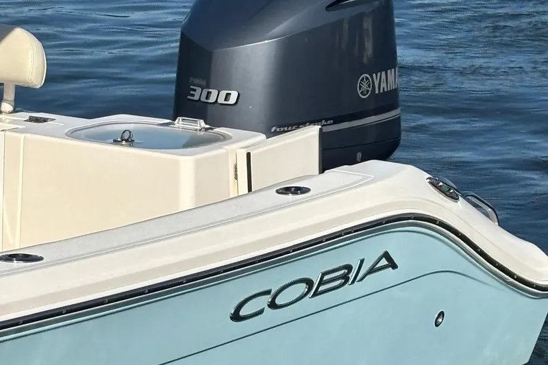 Slide: The Image of 2019 Cobia 240 Center Console boat with Yamaha 300 engine on water. - 7