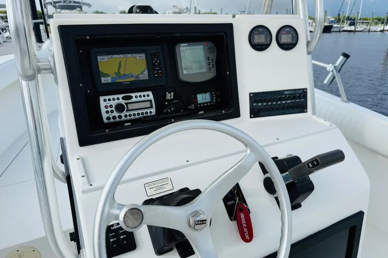 Slide: The Image of Control panel of a 2000 Regulator 23 Classic boat with navigation equipment. - 11