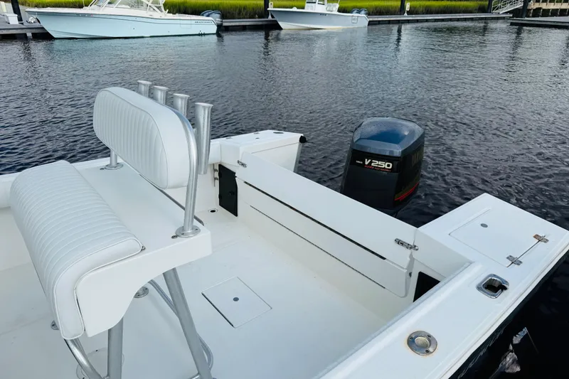 Slide: The Image of 2000 Regulator 23 Classic boat with Yamaha V250 engine at dock. - 12