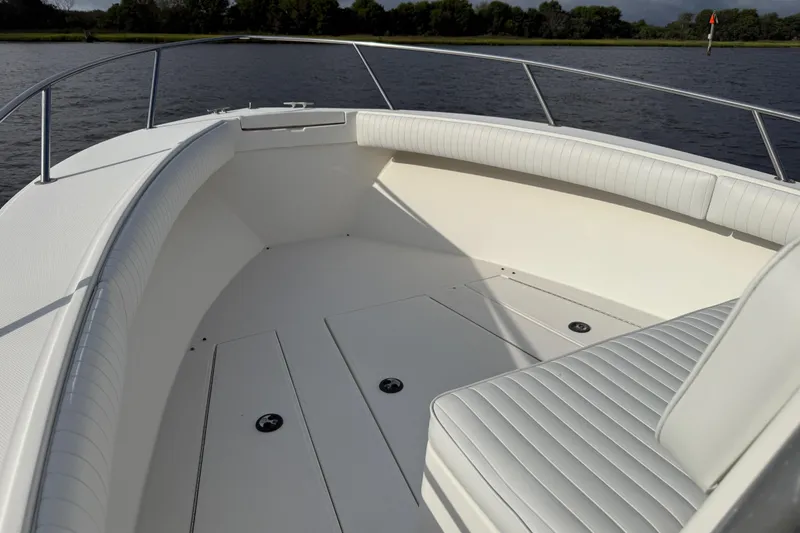 Slide: The Image of 2000 Regulator 23 Classic boat interior with white seating and open deck. - 16