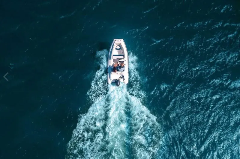 Slide: The Image of Aerial view of AB Inflatables Nautilus 13 DLX boat on the sea. - 7