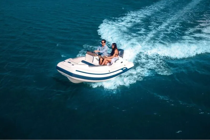 Slide: The Image of 2026 AB Inflatables Nautilus 13 DLX cruising on open water. - 9