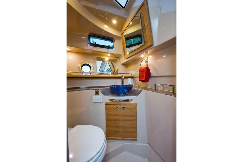 Slide: The Image of Manufacturer Provided Image: Luxurious bathroom interior of 2025 Ranger Tugs R-29 S with modern fixtures and elegant design. - 15