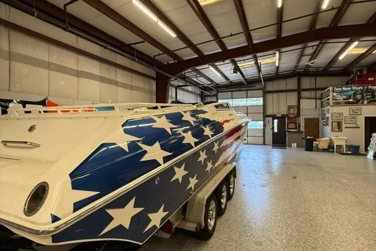Slide: The Image of 2004 Fountain 42 Lightning boat with star-spangled design in a spacious garage. - 3