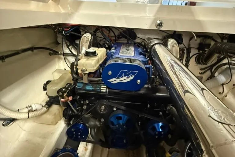 Slide: The Image of Engine compartment of a 2004 Fountain 42 Lightning boat, featuring a powerful marine engine. - 6