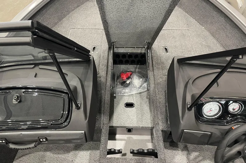 Slide: The Image of 2026 Crestliner 1750 Hawk WT J boat interior with dual consoles and storage compartments. - 12