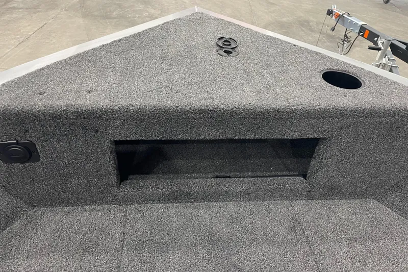 Slide: The Image of 2026 Crestliner 1750 Hawk WT J boat interior with carpeted storage area. - 14