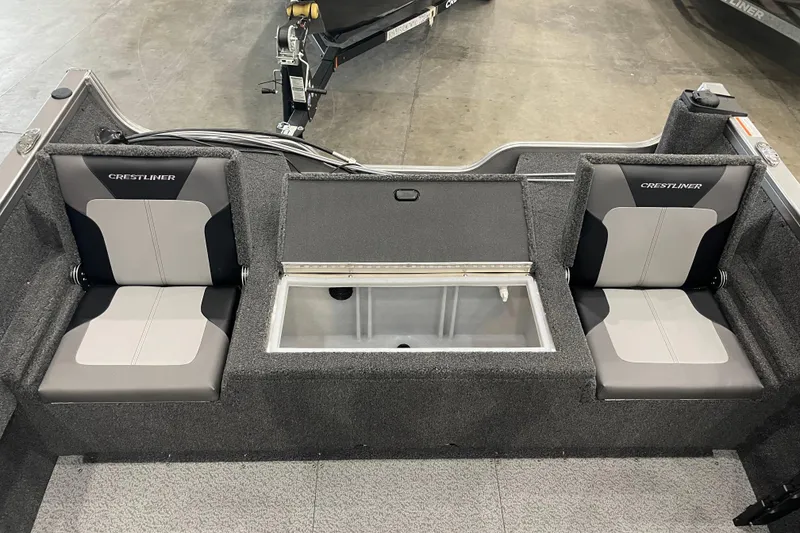 Slide: The Image of 2026 Crestliner 1750 Hawk WT J boat interior with dual seats and storage compartment. - 5