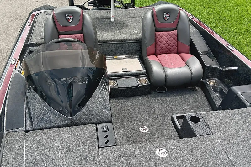 Slide: The Image of 2018 Triton 18 TrX boat interior with dual seats and windshield. - 10