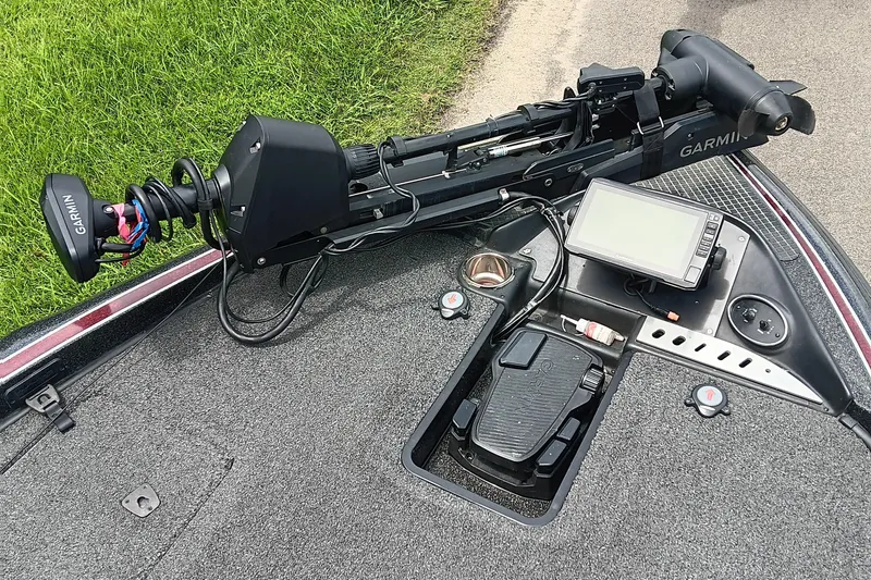 Slide: The Image of 2018 Triton 18 TrX boat deck with Garmin trolling motor and fishfinder. - 7