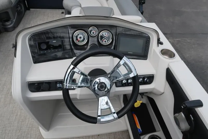 Slide: The Image of Steering console of 2022 Avalon 26 LSV VRB boat with modern controls and gauges. - 13