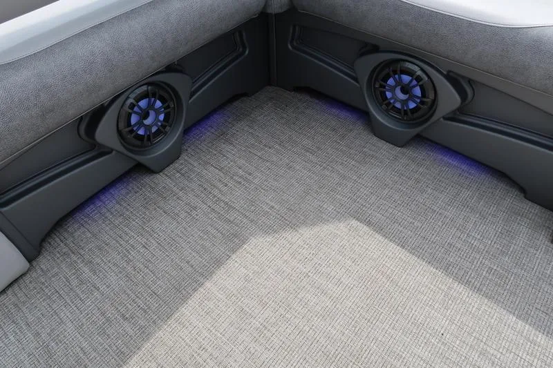 Slide: The Image of 2022 Avalon 26 LSV VRB boat interior with speakers and gray upholstery. - 14