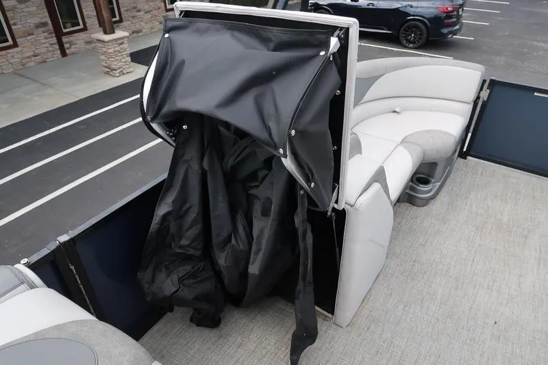 Slide: The Image of 2022 Avalon 26 LSV VRB boat interior with seating and storage compartment. - 20