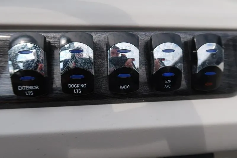 Slide: The Image of Control panel of a 2022 Avalon 26 LSV VRB with labeled switches. - 26