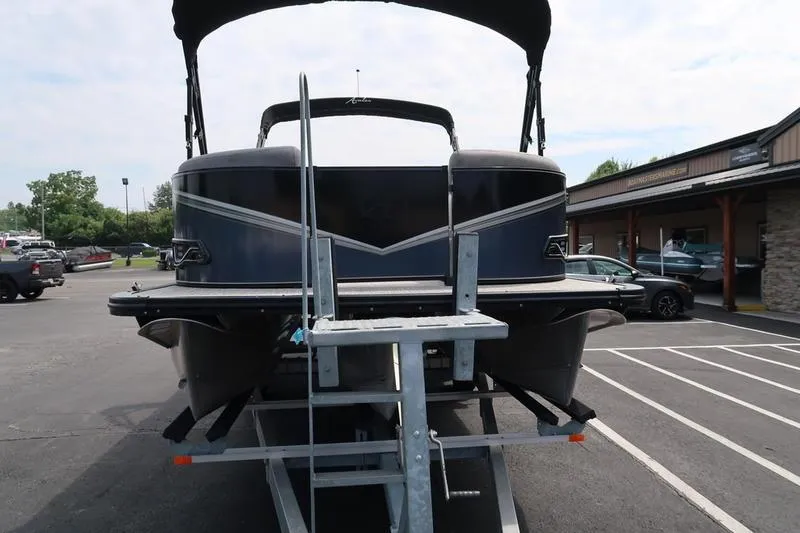 Slide: The Image of 2022 Avalon 26 LSV VRB pontoon boat on trailer in parking lot. - 4