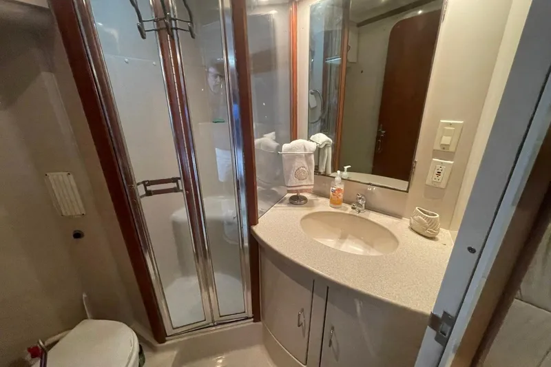 Slide: The Image of Bathroom interior of 1997 Luhrs 36 SX yacht with shower and vanity. - 17