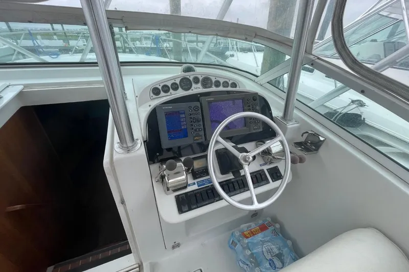 Slide: The Image of Helm of 1997 Luhrs 36 SX boat with navigation equipment and steering wheel. - 23