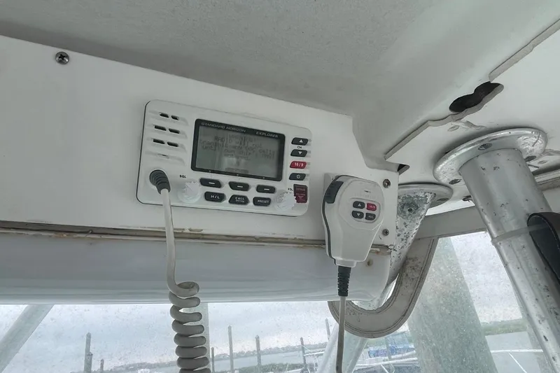 Slide: The Image of Marine radio equipment on a 1997 Luhrs 36 SX boat dashboard. - 30