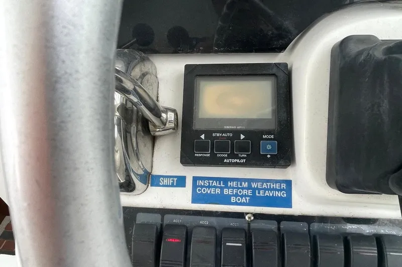 Slide: The Image of Control panel of a 1997 Luhrs 36 SX boat with autopilot display. - 31