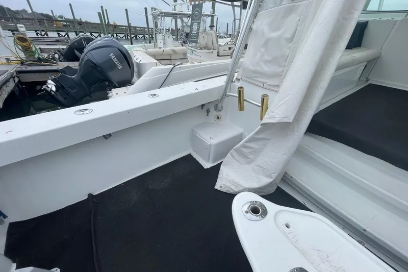 Slide: The Image of 1997 Luhrs 36 SX boat interior with Yamaha outboard motor at dock. - 34